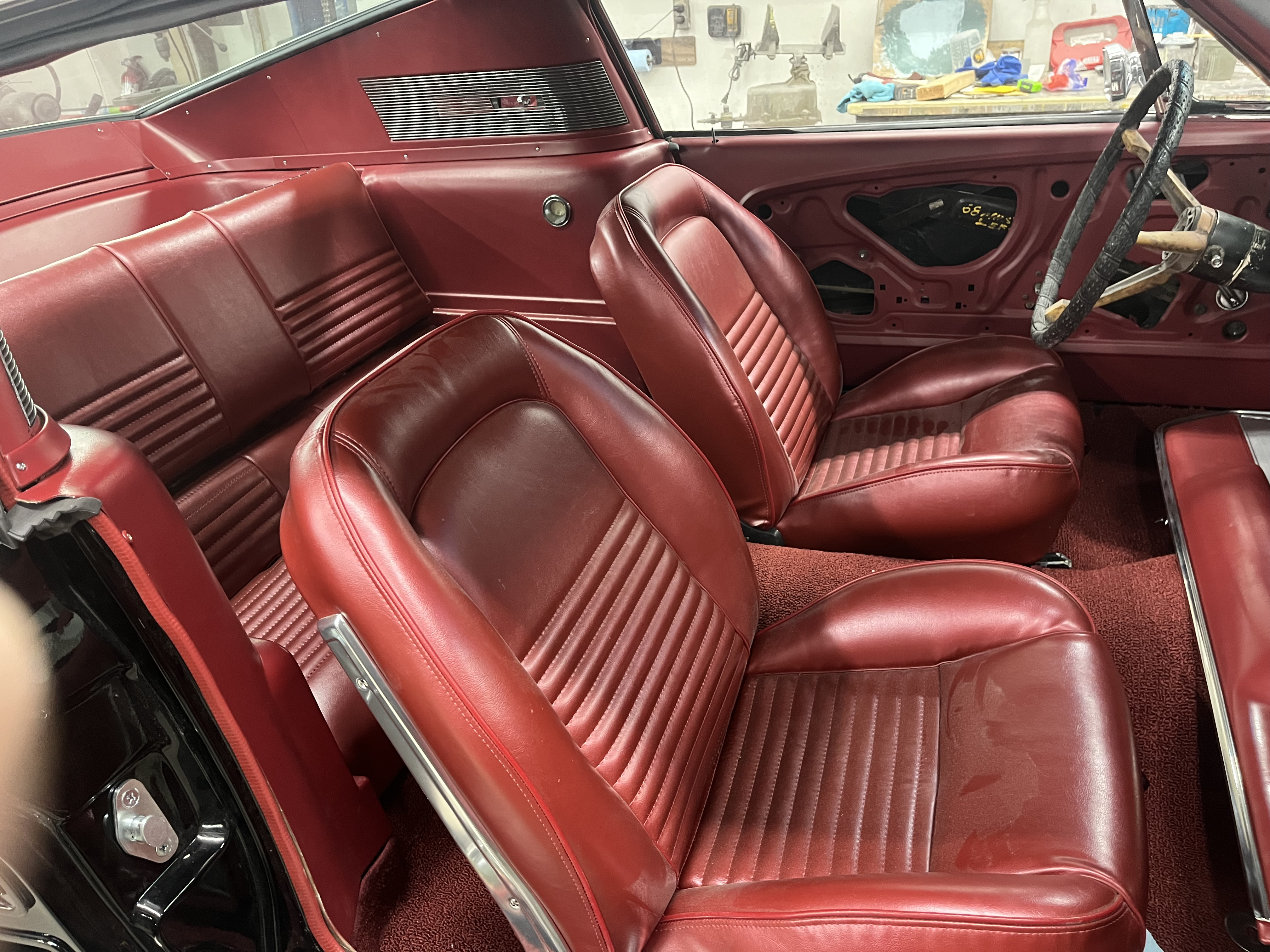 1967 Ford Mustang Fastback new red interior installed by Klassy Kar Sales